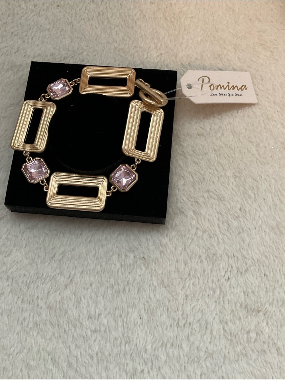 Pomina Gold-Tone Bracelet with Light Pink Gem Accents